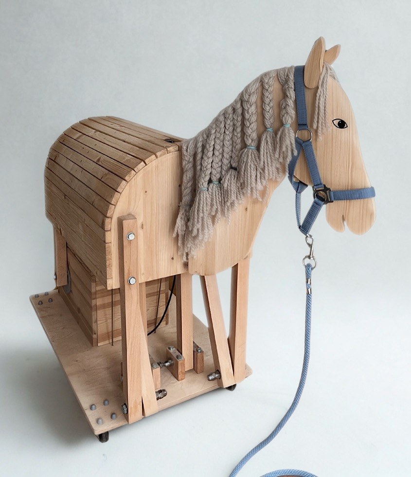 Life-size mechanical riding horse built from wood